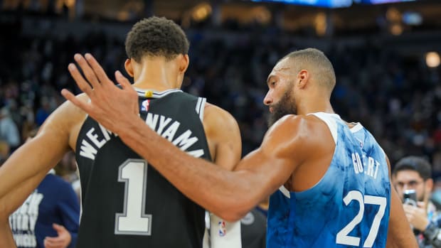 Feb 27, 2024; Minneapolis, Minnesota, USA; Minnesota Timberwolves center Rudy Gobert (27) and San Antonio Spurs center Victor Wembanyama (1) talk after the game at Target Center.